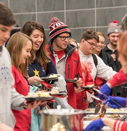 Students in line for food in the dining hall.